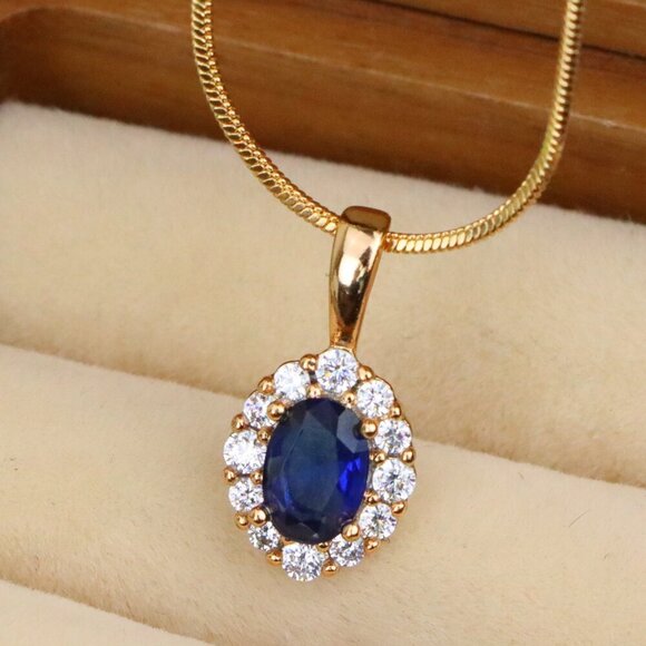 "Royal Blue Oval Pendant with Halo in Gold-Plated Brass Setting, XPPT1815 - Picture 1 of 13